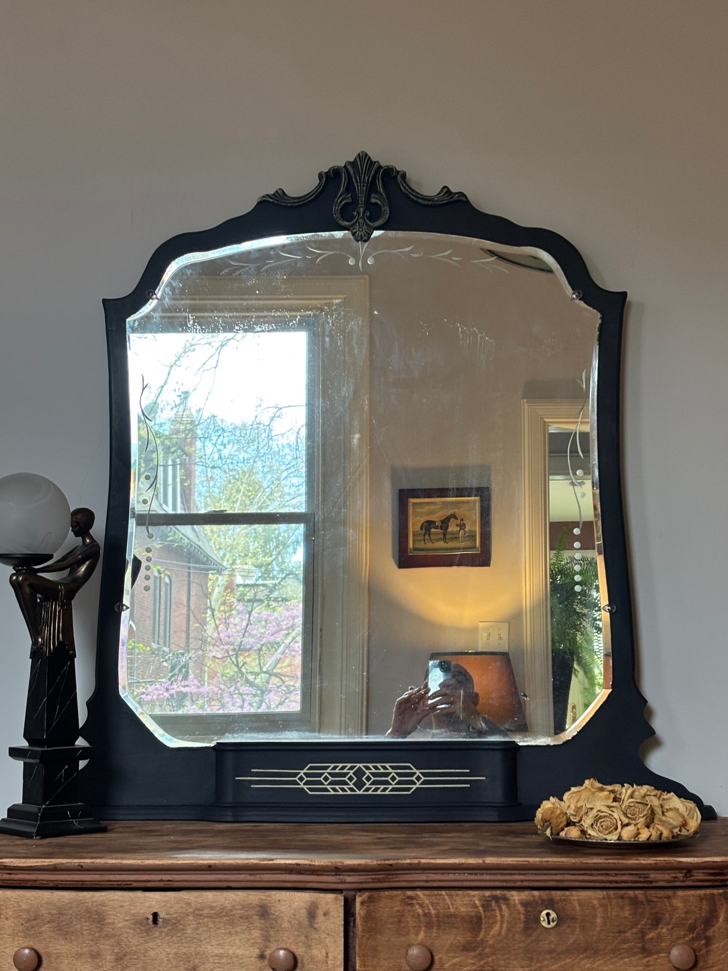 A one-of-a-kind Art Deco mirror featuring an original etched beveled mirror, rich midnight blue finish, and hand-burnished silver accents that capture the timeless glamour of the Jazz Age
