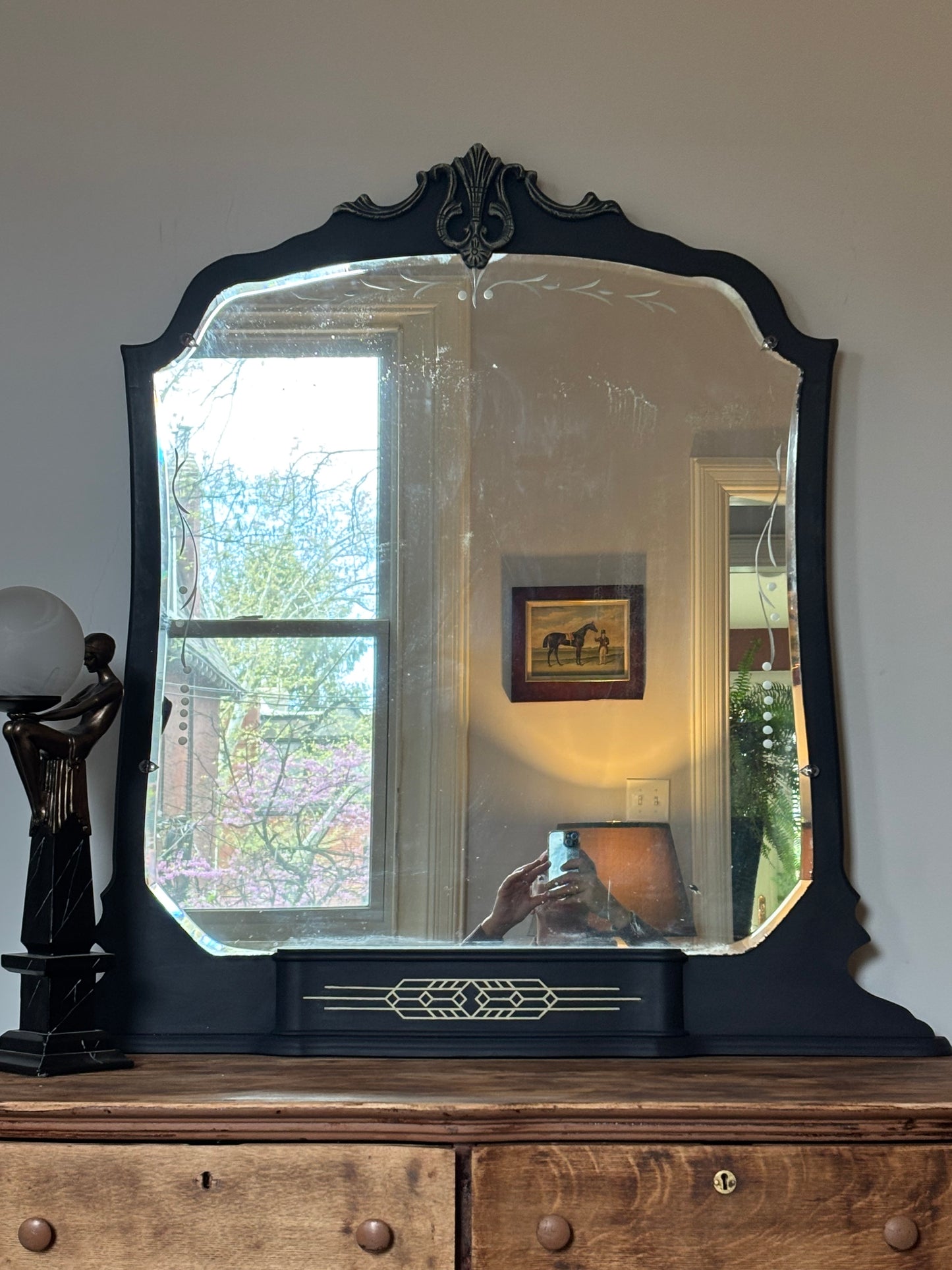 A one-of-a-kind Art Deco mirror featuring an original etched beveled mirror, rich midnight blue finish, and hand-burnished silver accents that capture the timeless glamour of the Jazz Age