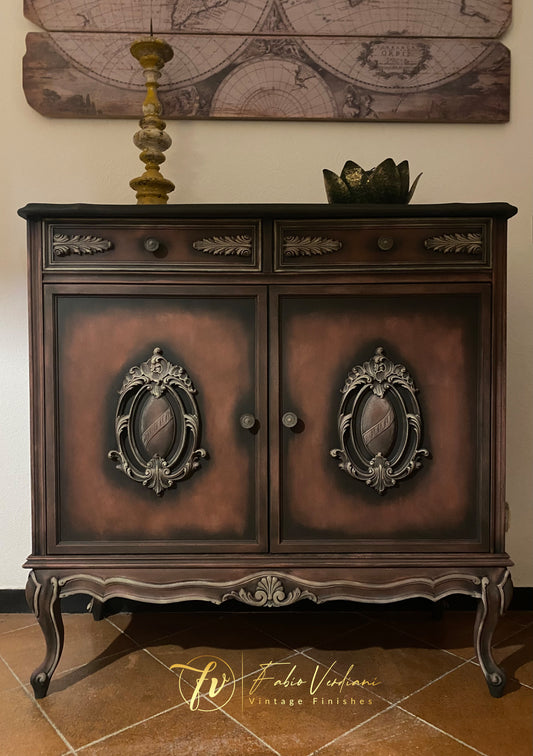 Small cabinet. Annie Sloan Graphite, dry brushing in Primer Red and details in Versailles Yellow. Stencils on each side, clear  and black wax.