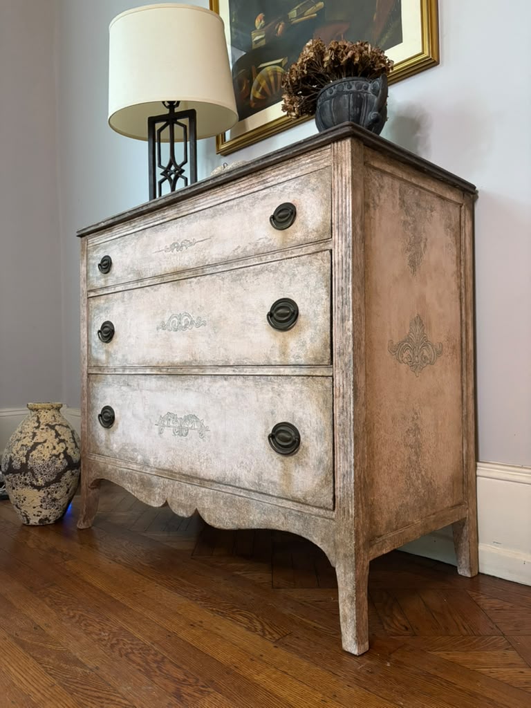 Vintage chest of drawers,  hand-finished limestone patina, subtle ornamental details, and rich bronze hardware for understated European elegance