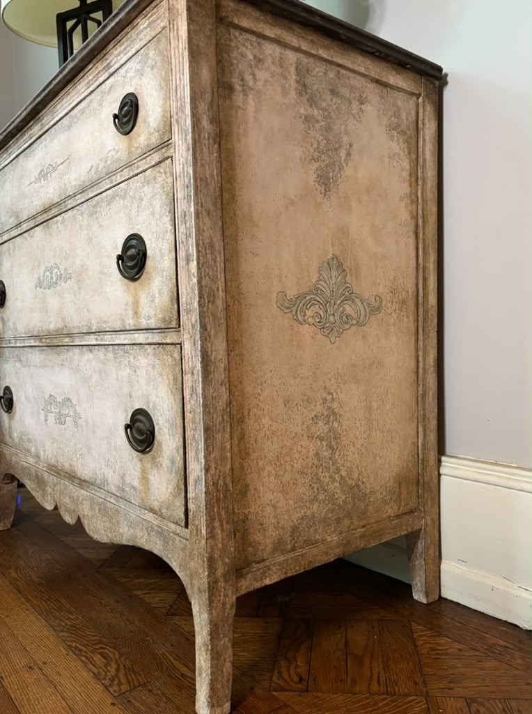 Vintage chest of drawers,  hand-finished limestone patina, subtle ornamental details, and rich bronze hardware for understated European elegance