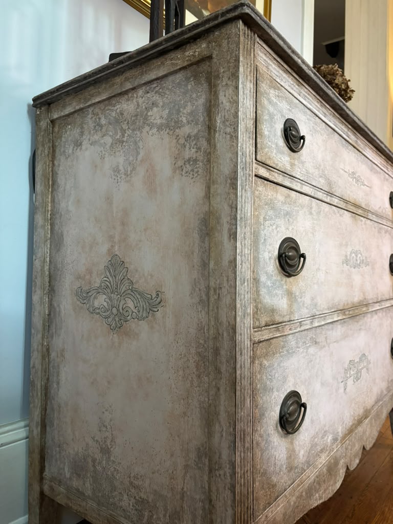 Vintage chest of drawers,  hand-finished limestone patina, subtle ornamental details, and rich bronze hardware for understated European elegance