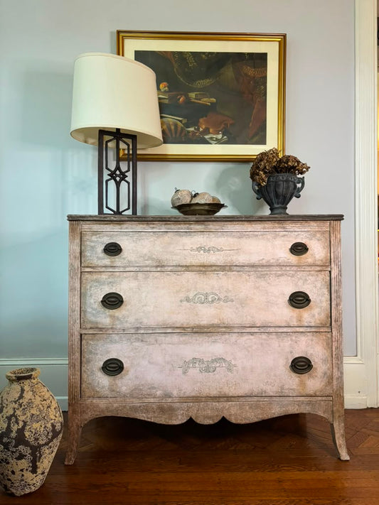Vintage chest of drawers,  hand-finished limestone patina, subtle ornamental details, and rich bronze hardware for understated European elegance